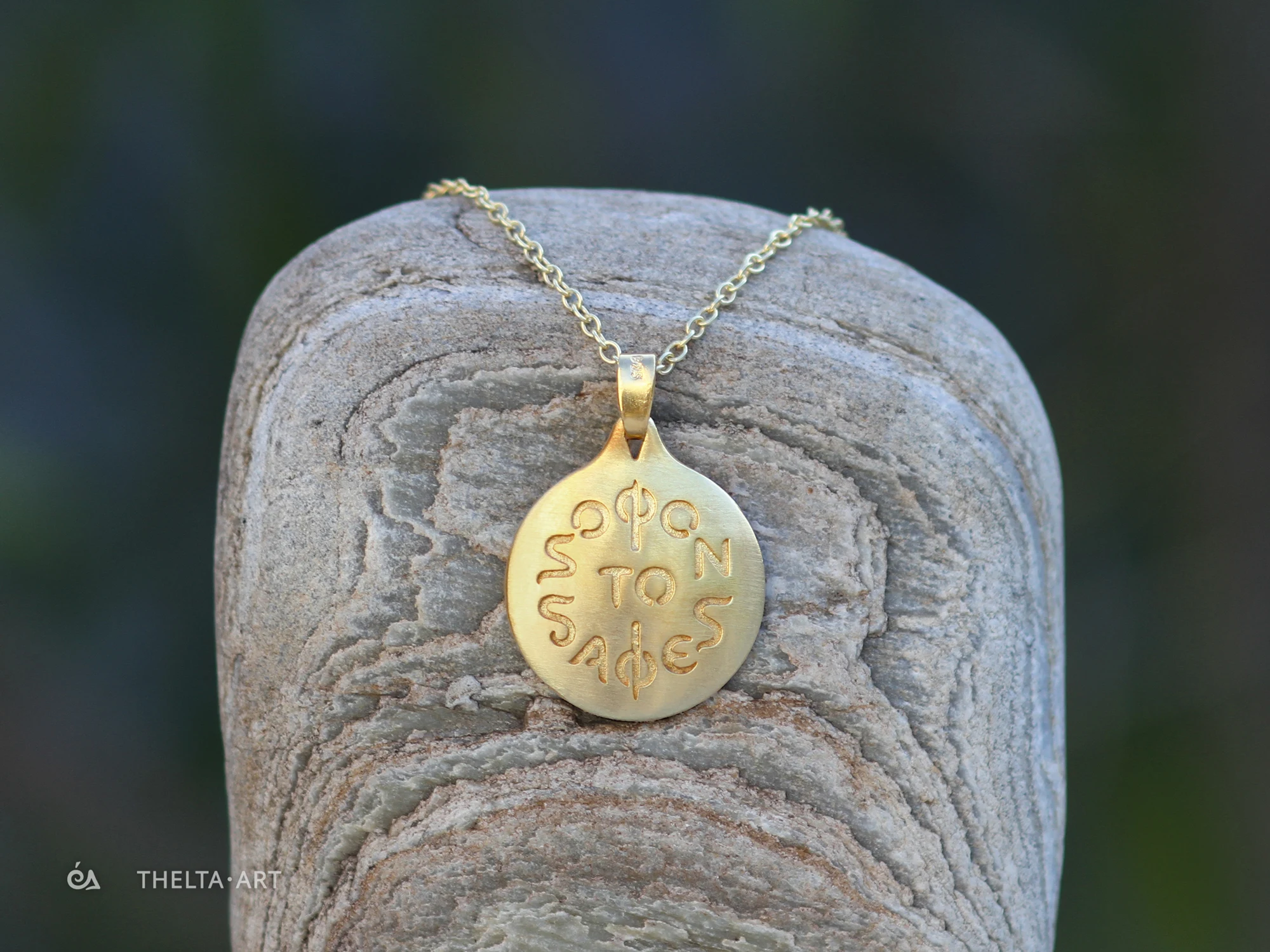 "Sofon to Safes" - a handmade, gold-plated 925 silver pendant and chain with colorless script.