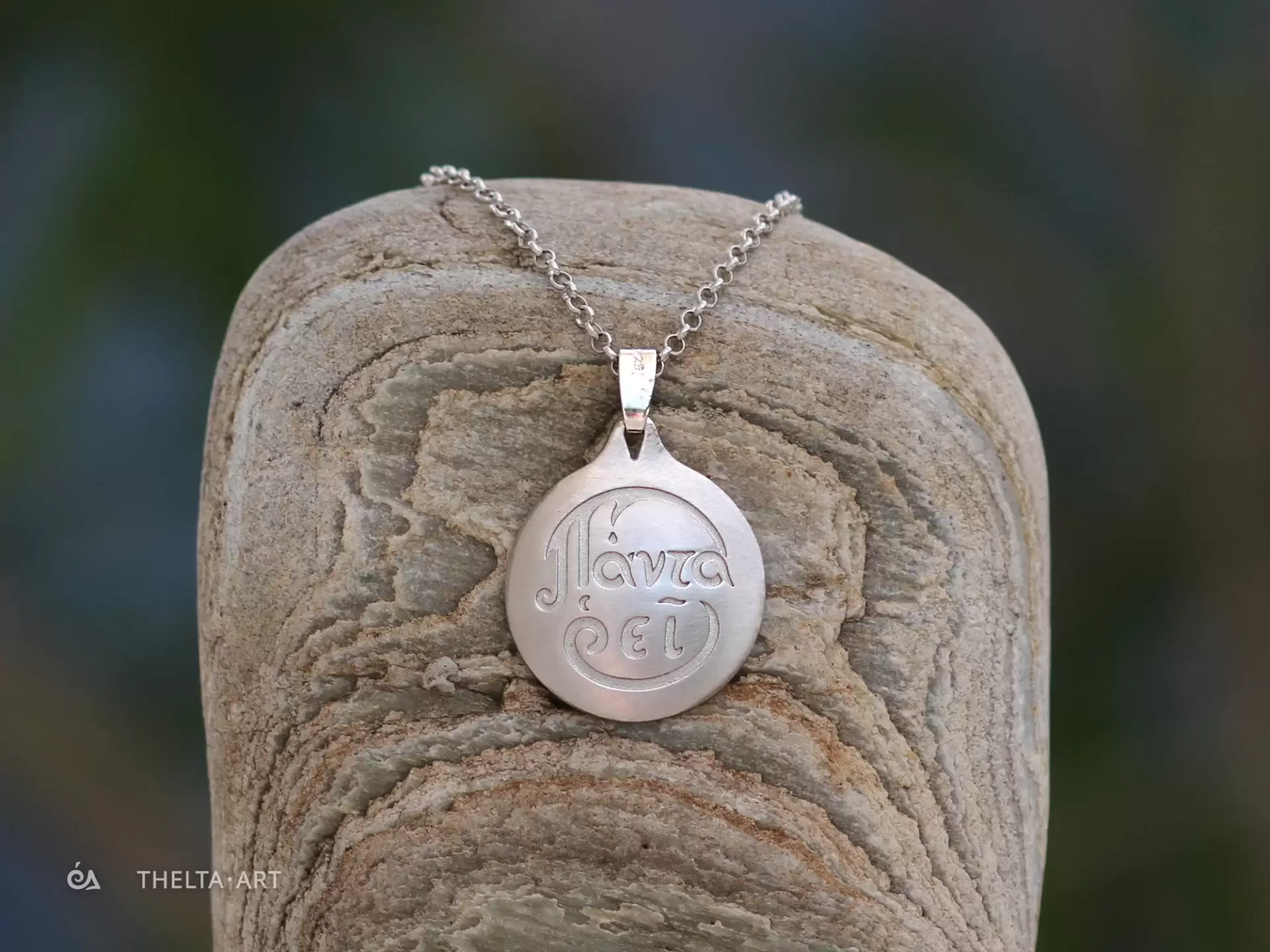"Panta rhei" - a handmade, platinum-plated 925 silver pendant and chain with colorless script.