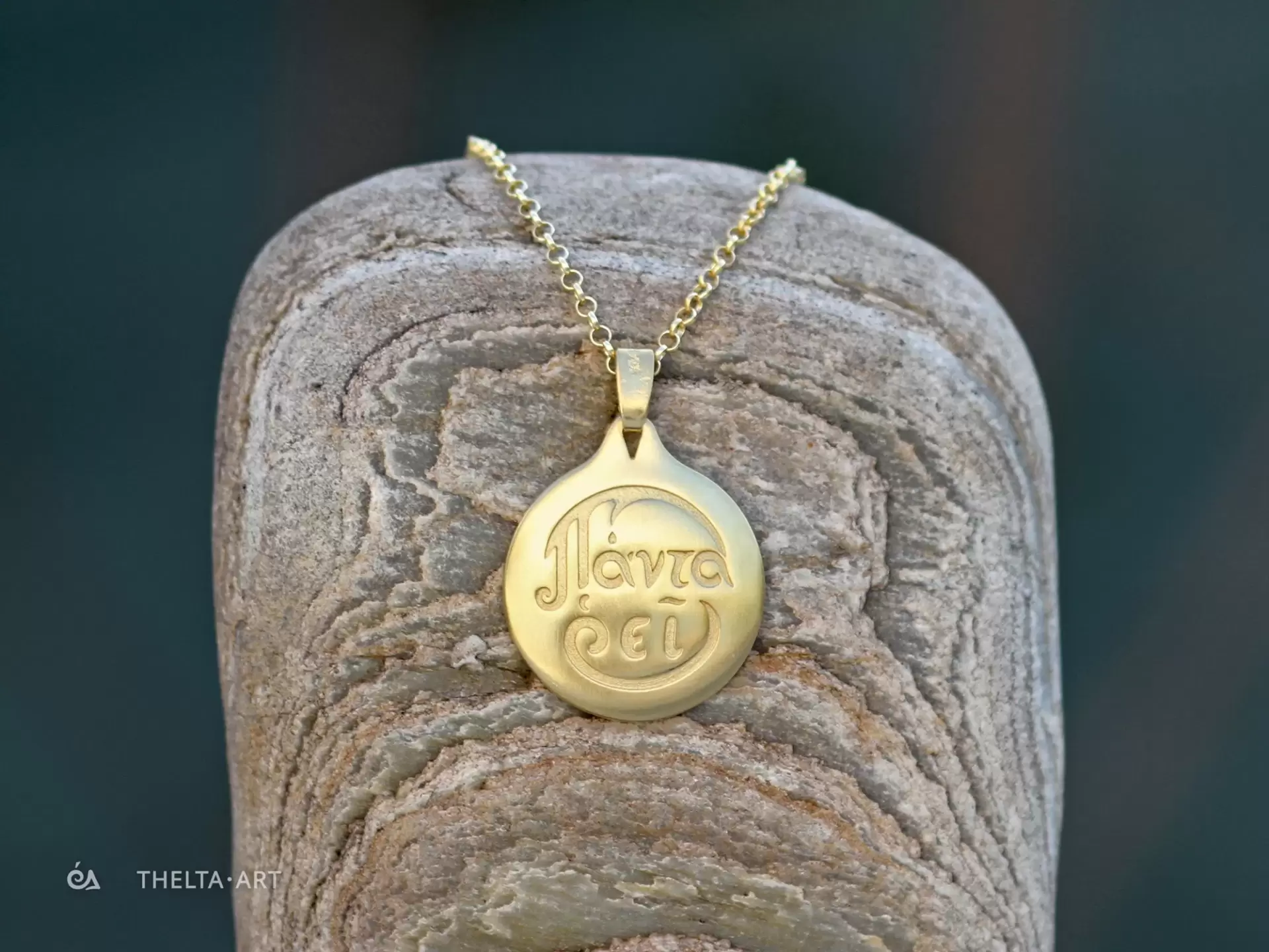 "Panta rhei" - a handmade, gold-plated 925 silver pendant and chain with colorless script.